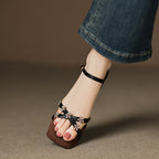 [M144] 에로웬(Elowen) 플라워 스톤 크로스 스트랩 샌들 2.5cm - 블랙
